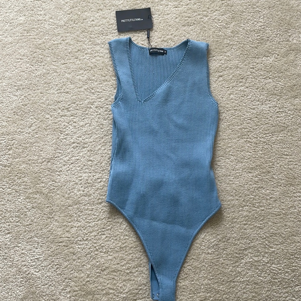 Blue bodysuit. New with tags.